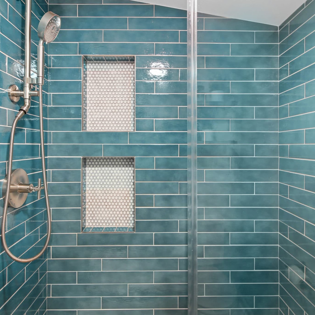 stylish remodeled bathroom with blue tiles